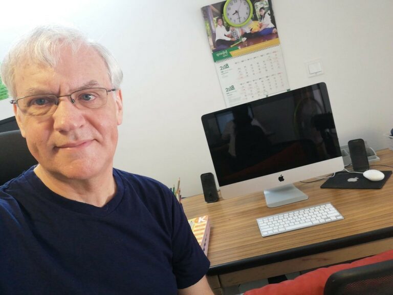 Paul Hughes working at home in Phnom Penh, Cambodia